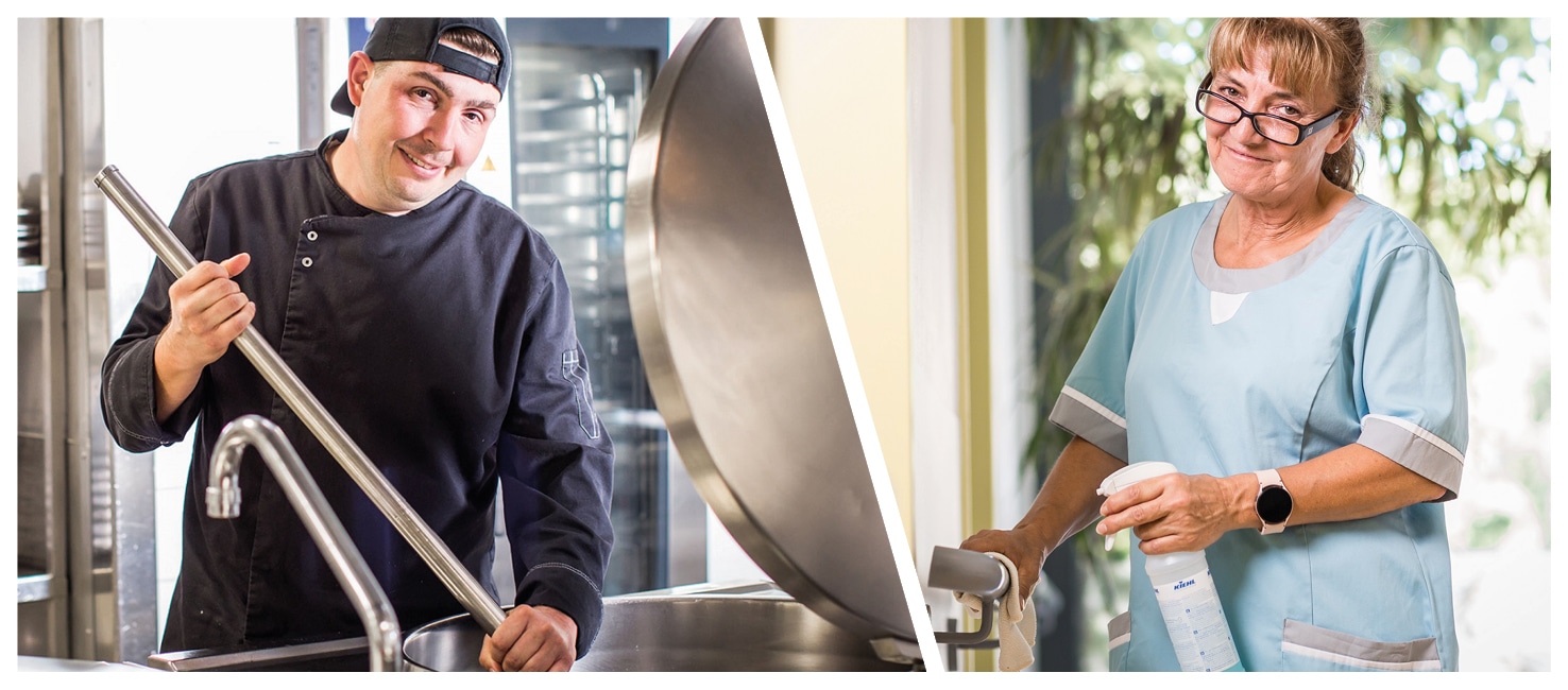 KI-basierte Bildbeschreibung | Ein Mann in einer Kochuniform rührt einen großen Topf in einer Küche um, während eine Frau in Reinigungskleidung eine Sprühflasche in der Hand hält und einen Türgriff abwischt.